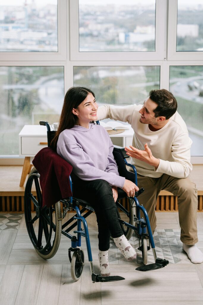 A loving couple shares a joyful moment in a bright indoor setting, embracing love and unity.